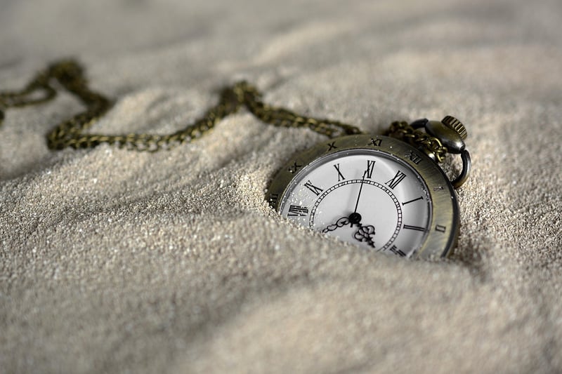 Clock in surreal landscape